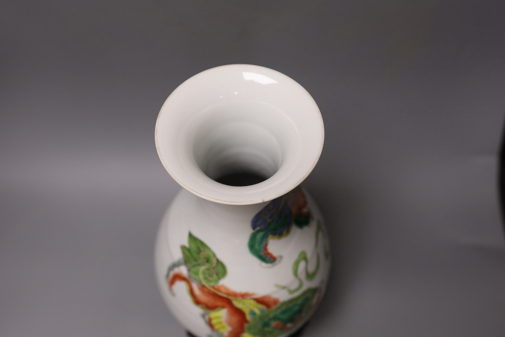 A Chinese famille verte pear-shaped ‘Buddhist lion’ vase, on stand, 32 cms high not including stand